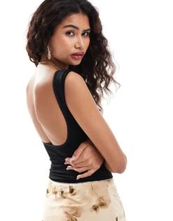 Free People Scoop Back Baby T-shirt In Black For Women