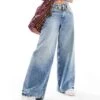 Free People Mid-rise Wide Leg Jeans In Mid Blue For Women Outlaw