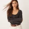 Free People Ruched Sleeve Pointelle Henley Top In Washed Black For Women